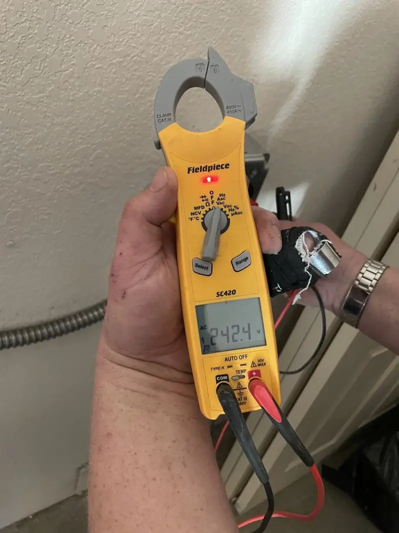 Voltage testing with clamp meter during Outlet Installation in Winton